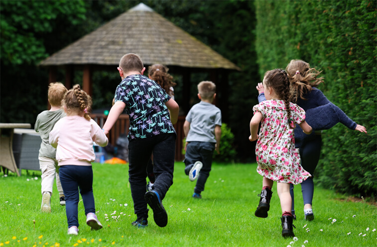 Children running on grass