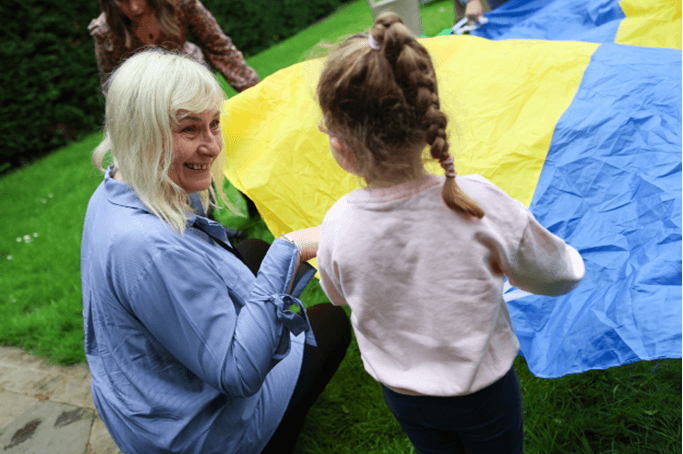 adult and child playing